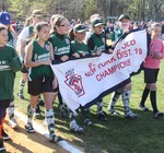 The softball team players brought in their 2011 champion banner.
