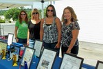 HVSPCA volunteers Laura Klein, Nora Miceli, Alexis Fitch, and Mary McClennan at the raffle table.