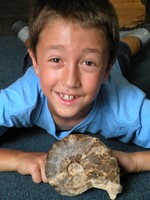 Anthony Giorgianni of Newburgh with Ammonite. photo by Judy Onufer.