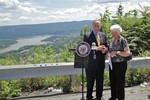 Senator Schumer receives chain link gift from Betsy Pugh, Chairwoman of Constitution Island.