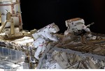 Astronauts Heidemarie Stefanyshyn-Piper (left) and Shane Kimbrough perform construction and maintenance on the International Space Station. Credit: NASA.