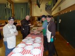 Photo by Jim Lennon. Cornwall Knights of Columbus Spaghetti Dinner. Grand Knight Jerry Gilman in hat and apron welcoming members if the Cornwall community