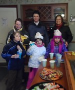 Photo by Jim Lennon. Hudson Highlands Nature Museum Director Jackie Grant (at far right) and Maureen & David Brand and their three children (L->R) Hayden, Jillian and Savannay enjoy s nice hot cup of coaco and snacks prior to the lecture at the Visitor's Center after prognostication by 