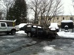 Photo by Jim Lennon. A Dodge SUV is the cause of the fire at Bernicker's.