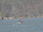 Photo by Jim Lennon. Ned Crossley windsurfing on the Hudson.