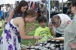 Photo by Wynn Gold. Sampling Coyote Kitchen Jam at RiverFest 2013.