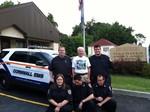 Back/standing -> Lieutenant Joseph Reardon, Cornwall July 4th Independence Day Committee Chair Brendan Coyne (in Cornwall July 4th T-shirt), Assistant Chief Sean Boyle and Front/kneeling -> Caitlin Masopust, Benjamin Friedlander and William June