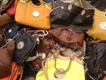 Counterfeit handbags seized at Fall Festival. Photo provided.
