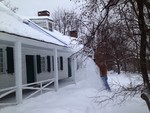 Removing snow from Sands Ring Homestead 