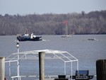 Photo by Jim Lennon. Coast Guard towing small boat on Hudson River.