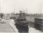 Historic image of a vessel traveling through the Troy Lock and Dam when it opened in 1915. Credit: USACE.