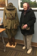 Ellen Dempsey with her father's uniform. Ellen was very excited to talk about her father, George Dempsey, and his heroic actions as a medic and surgen during the war.